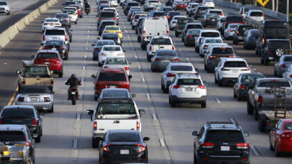 Motorcycle riding between lanes